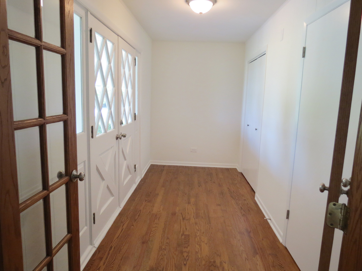 12970 McCarthy Road Lemont, IL 60439 - Photo 6 of 46 a view of a hallway with wooden floor and staircase