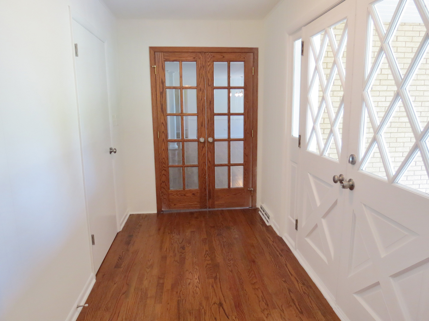 12970 McCarthy Road Lemont, IL 60439 - Photo 7 of 46 a view of hallway with wooden floor and fan