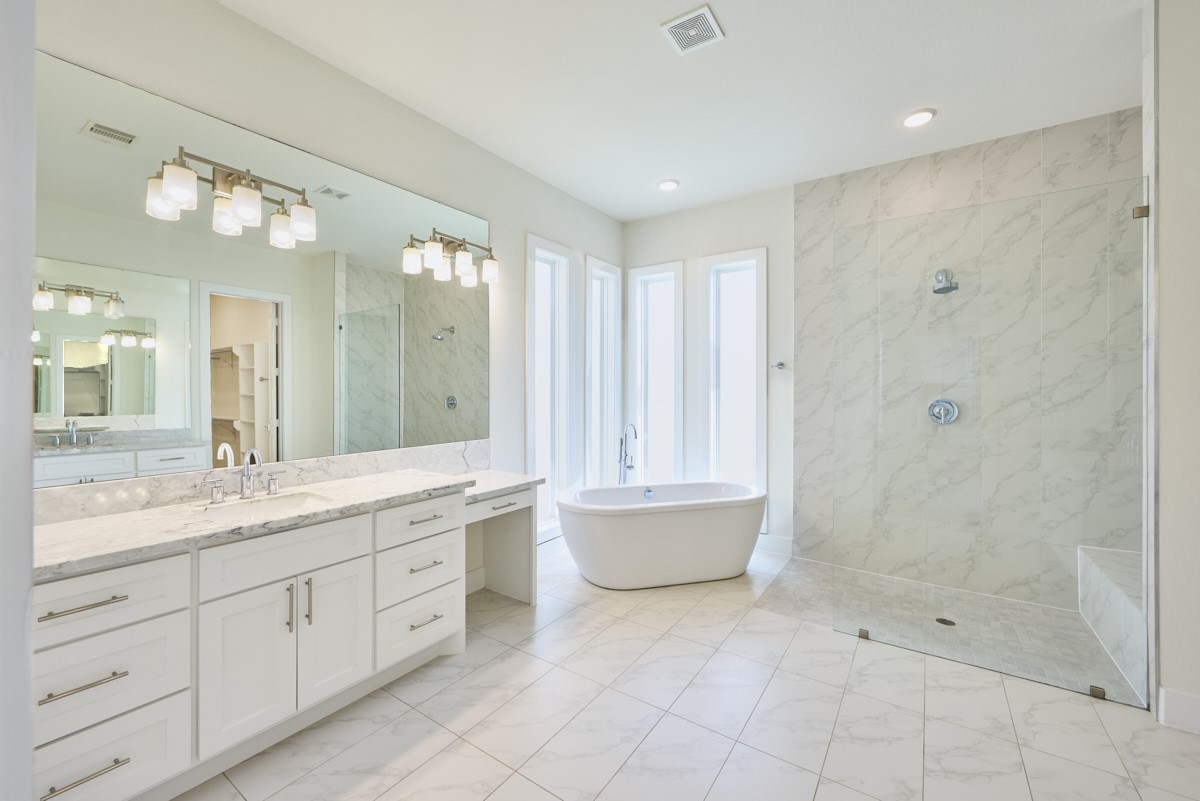 7911 Stratford Hall Drive Rosharon, TX 77583 - Photo 14 of 34 a spacious bathroom with a granite countertop sink a toilet and shower