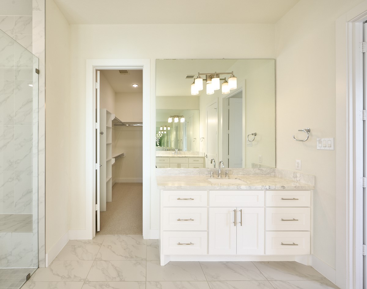 7911 Stratford Hall Drive Rosharon, TX 77583 - Photo 17 of 34 a bathroom with a granite countertop sink mirror and a
