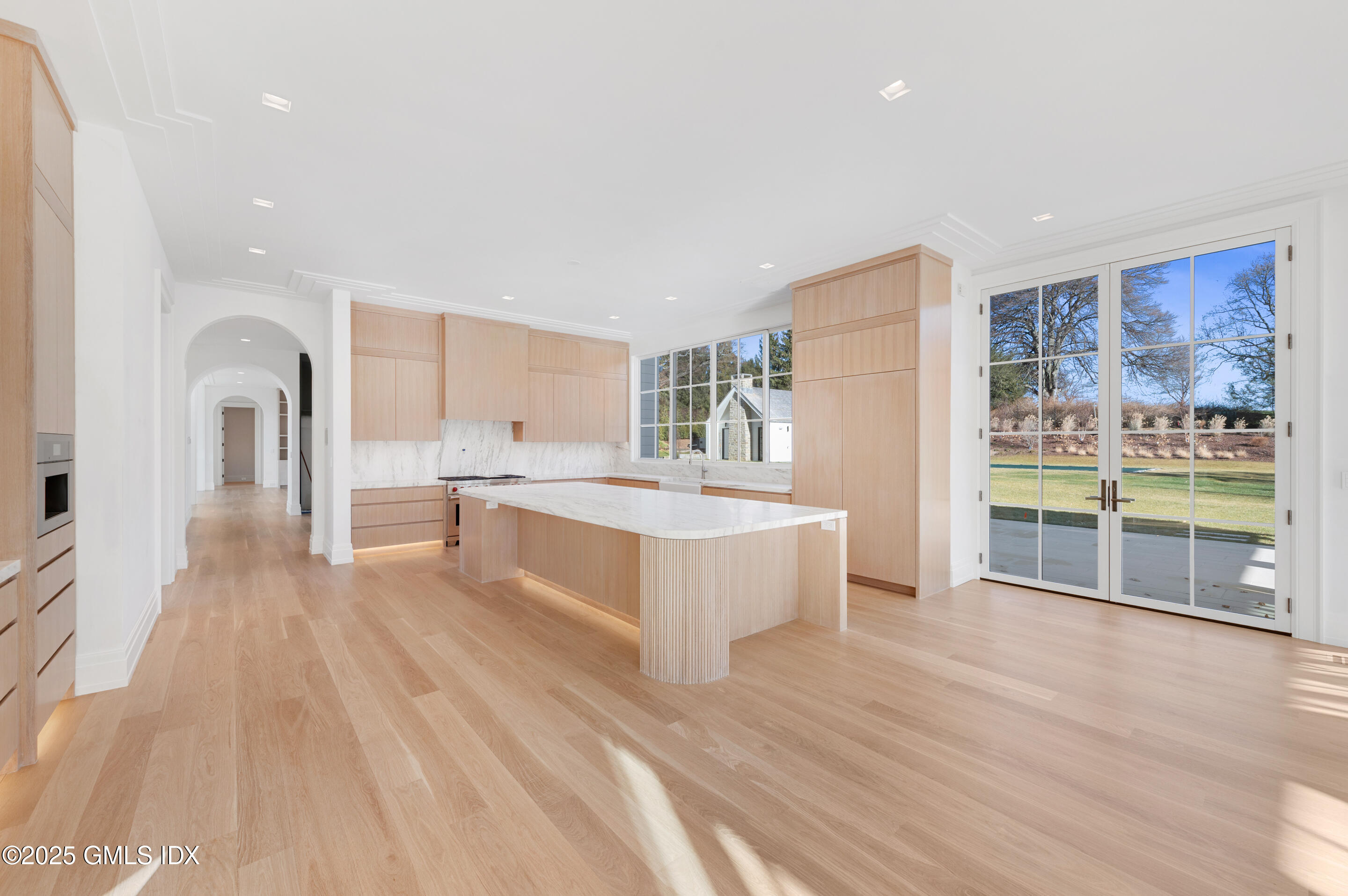 382 North Street Greenwich, CT 06830 - Photo 12 of 27 a large white kitchen with a large window