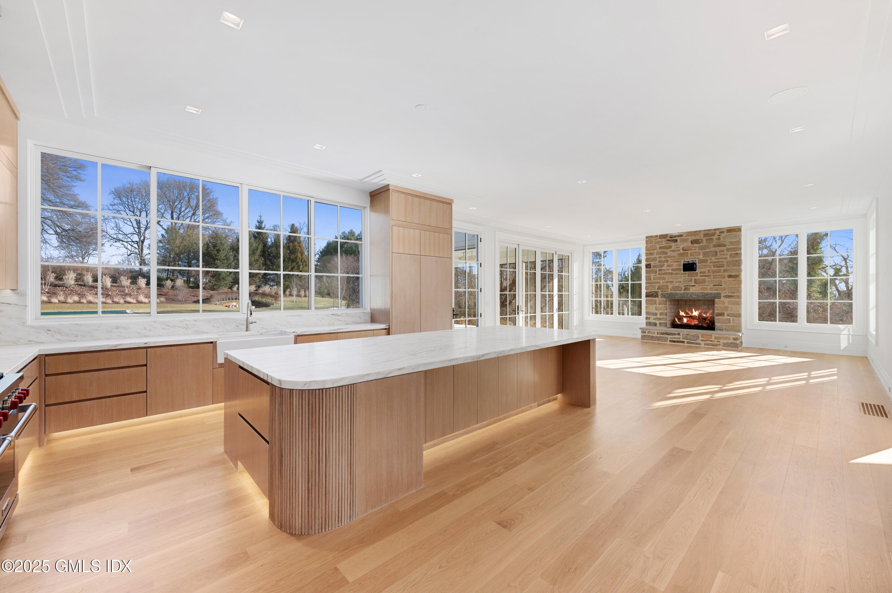 382 North Street Greenwich, CT 06830 - Photo 13 of 27 a living room with stainless steel appliances kitchen island granite countertop a refrigerator and cabinets