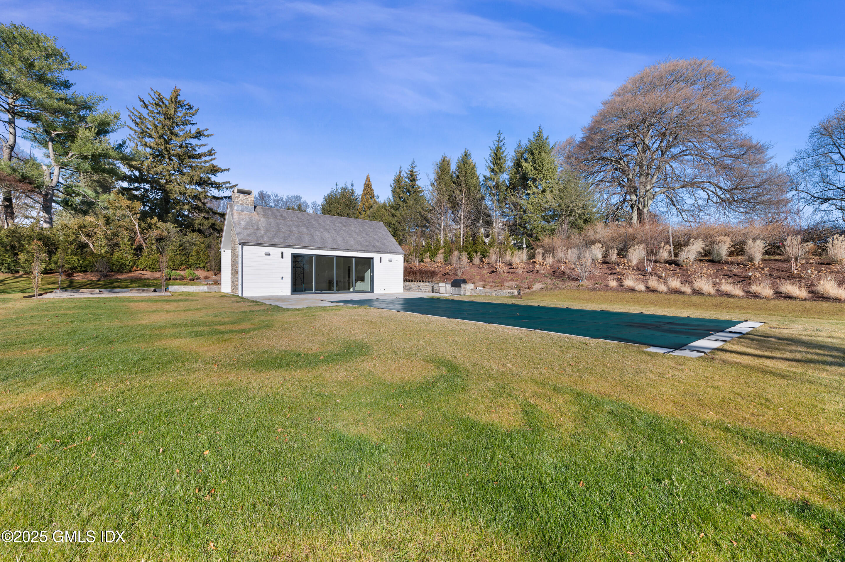 382 North Street Greenwich, CT 06830 - Photo 18 of 27 a house with garden in front of it