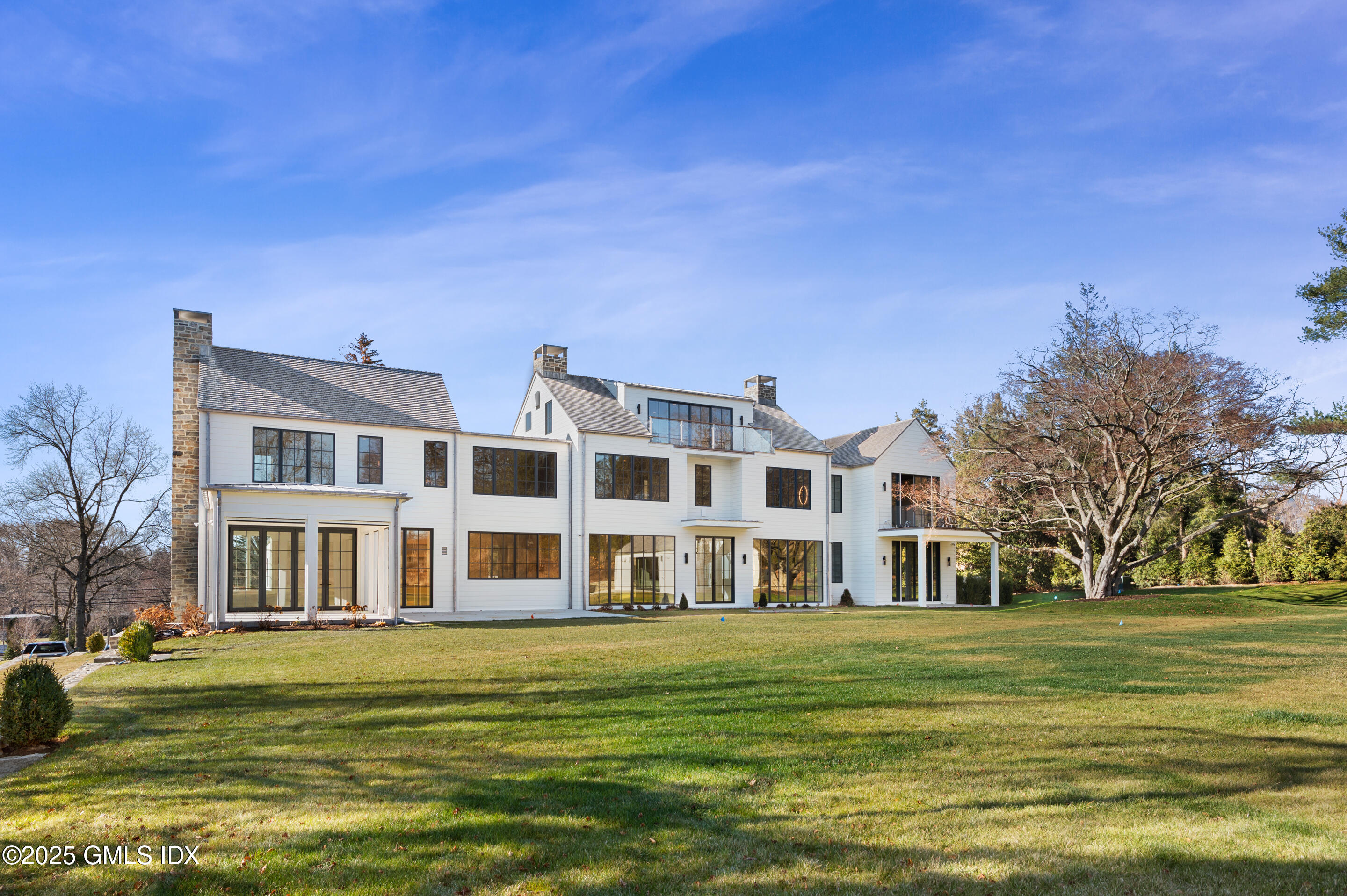 382 North Street Greenwich, CT 06830 - Photo 8 of 27 a front view of a building with a garden