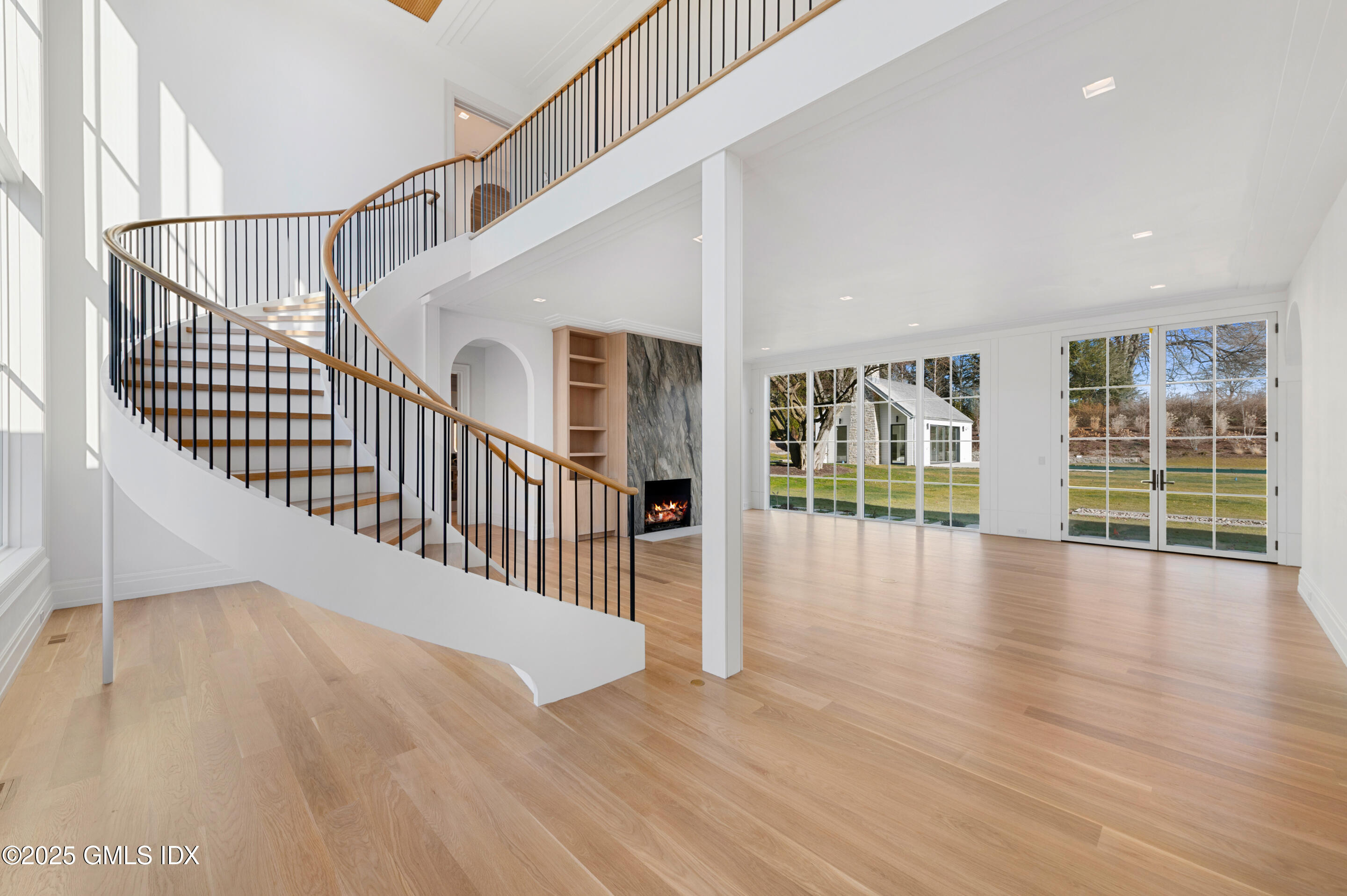 382 North Street Greenwich, CT 06830 - Photo 10 of 27 a view of staircase with wooden floor and white walls