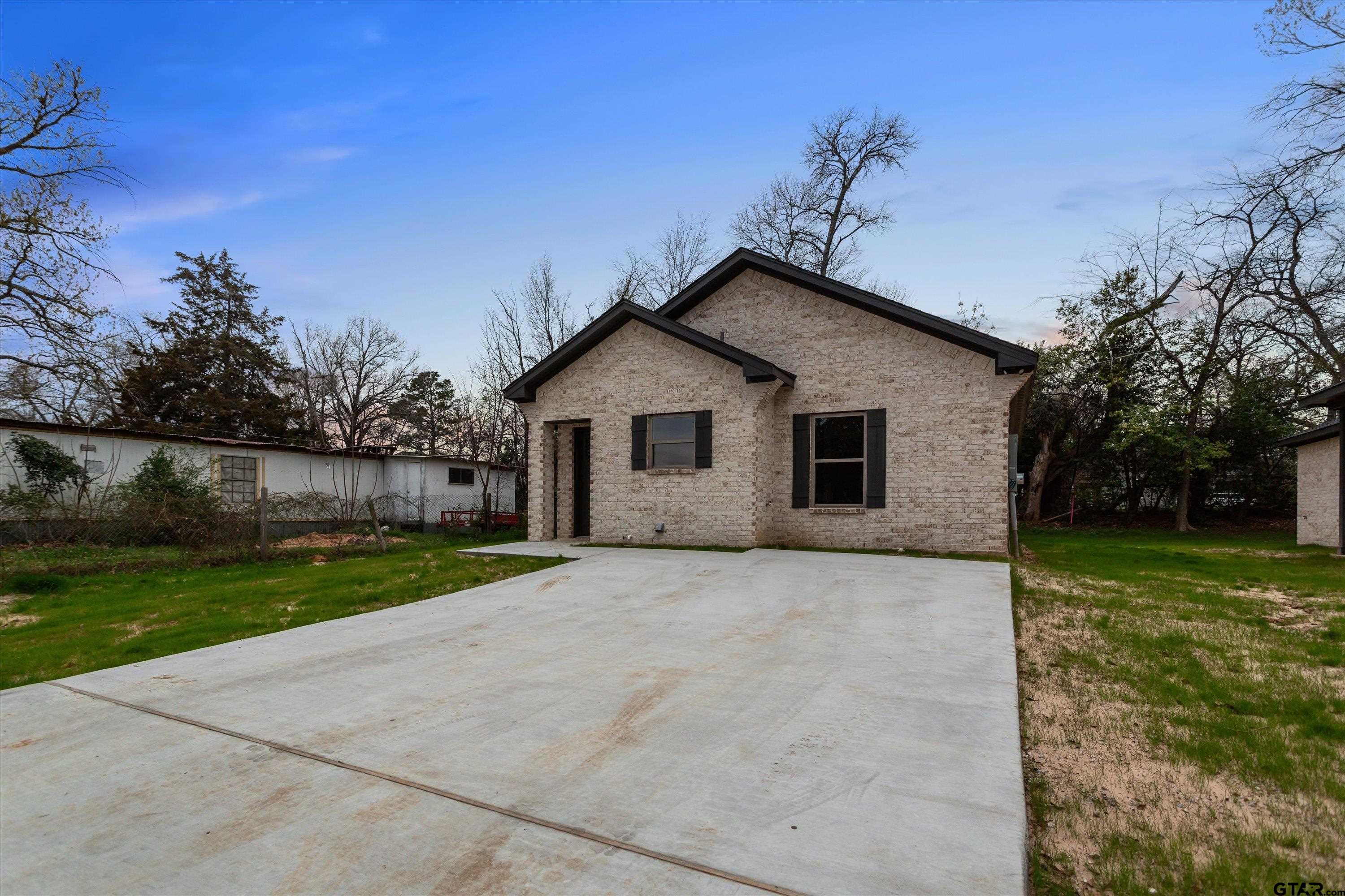 927 Nell Avenue Tyler, TX 75701 - Photo 2 of 20 a view of a house with a yard