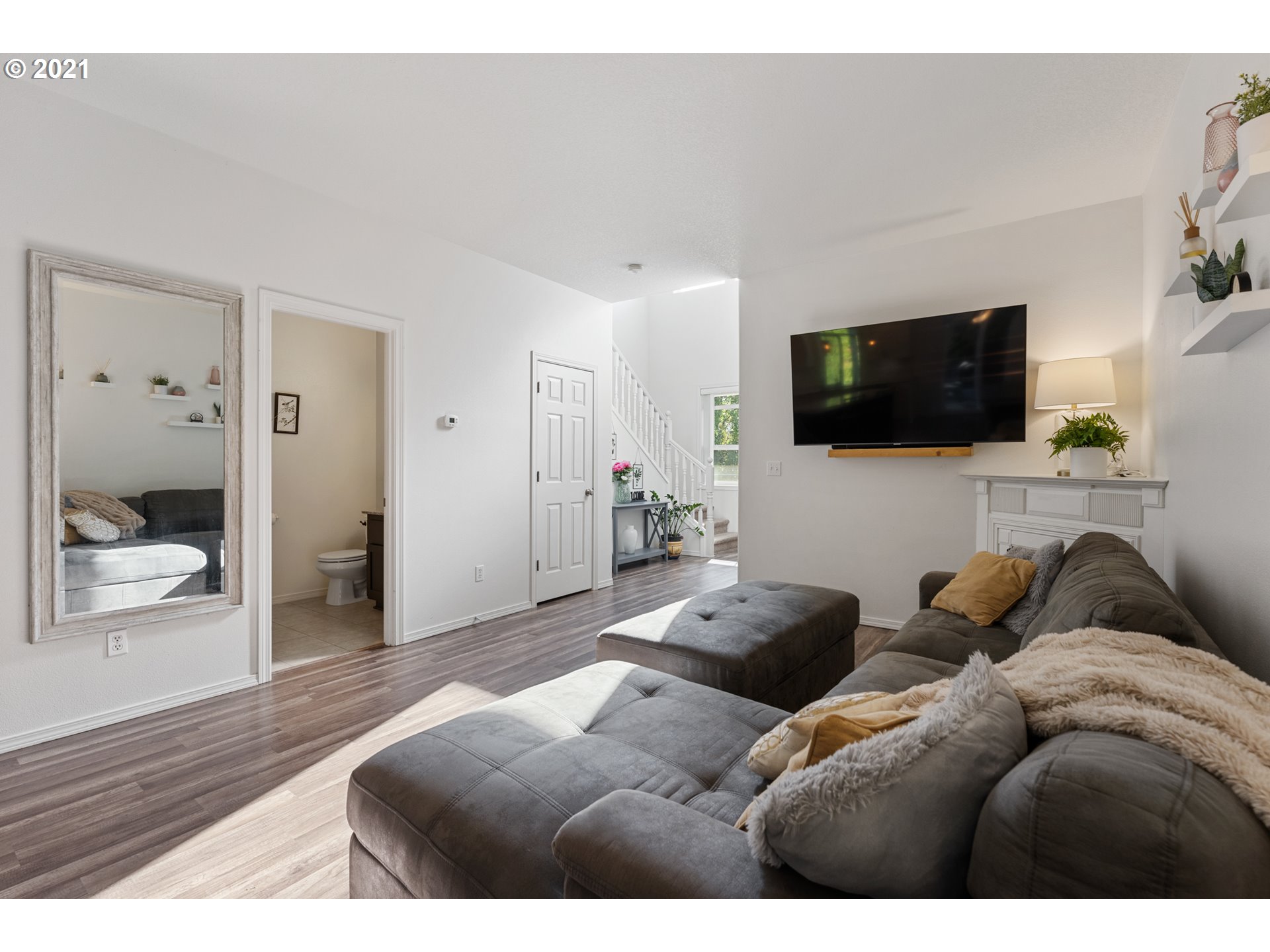3122 South 2nd Street Ridgefield, WA 98642 - Photo 11 of 30 a living room with furniture and a flat screen tv