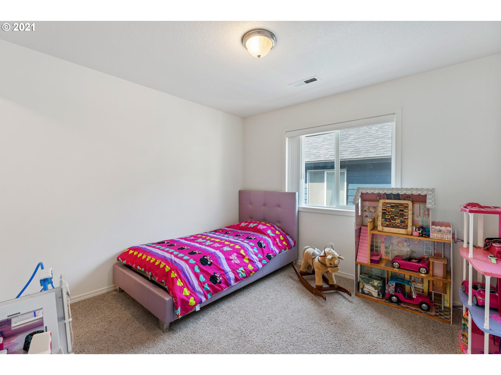 3122 South 2nd Street Ridgefield, WA 98642 - Photo 21 of 30 a bedroom with a bed window and a baby crib