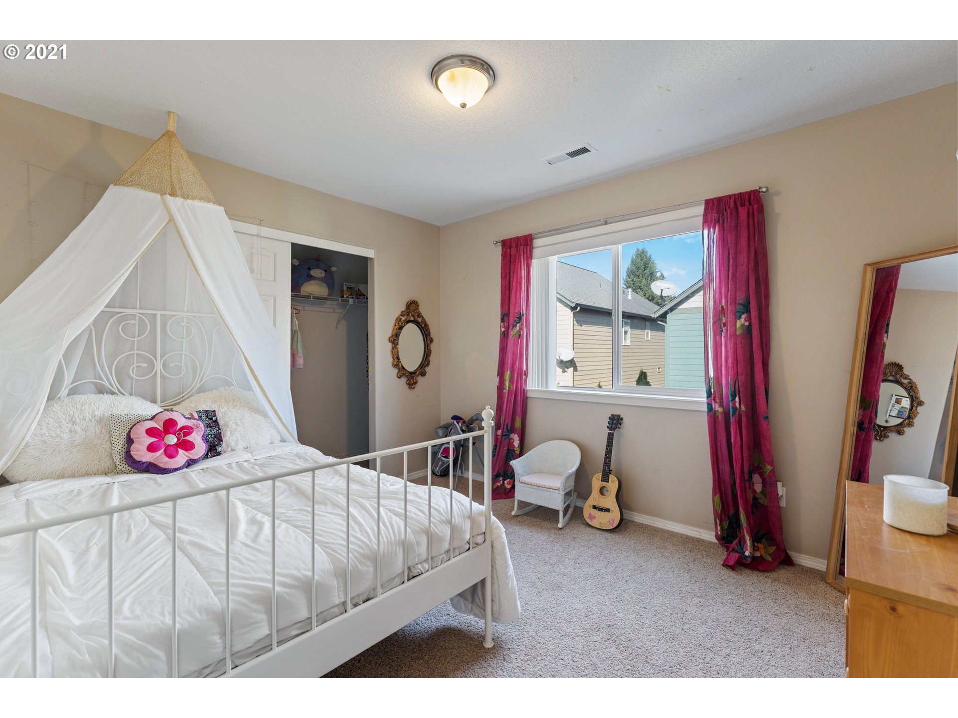 3122 South 2nd Street Ridgefield, WA 98642 - Photo 22 of 30 a bedroom with furniture and a chandelier