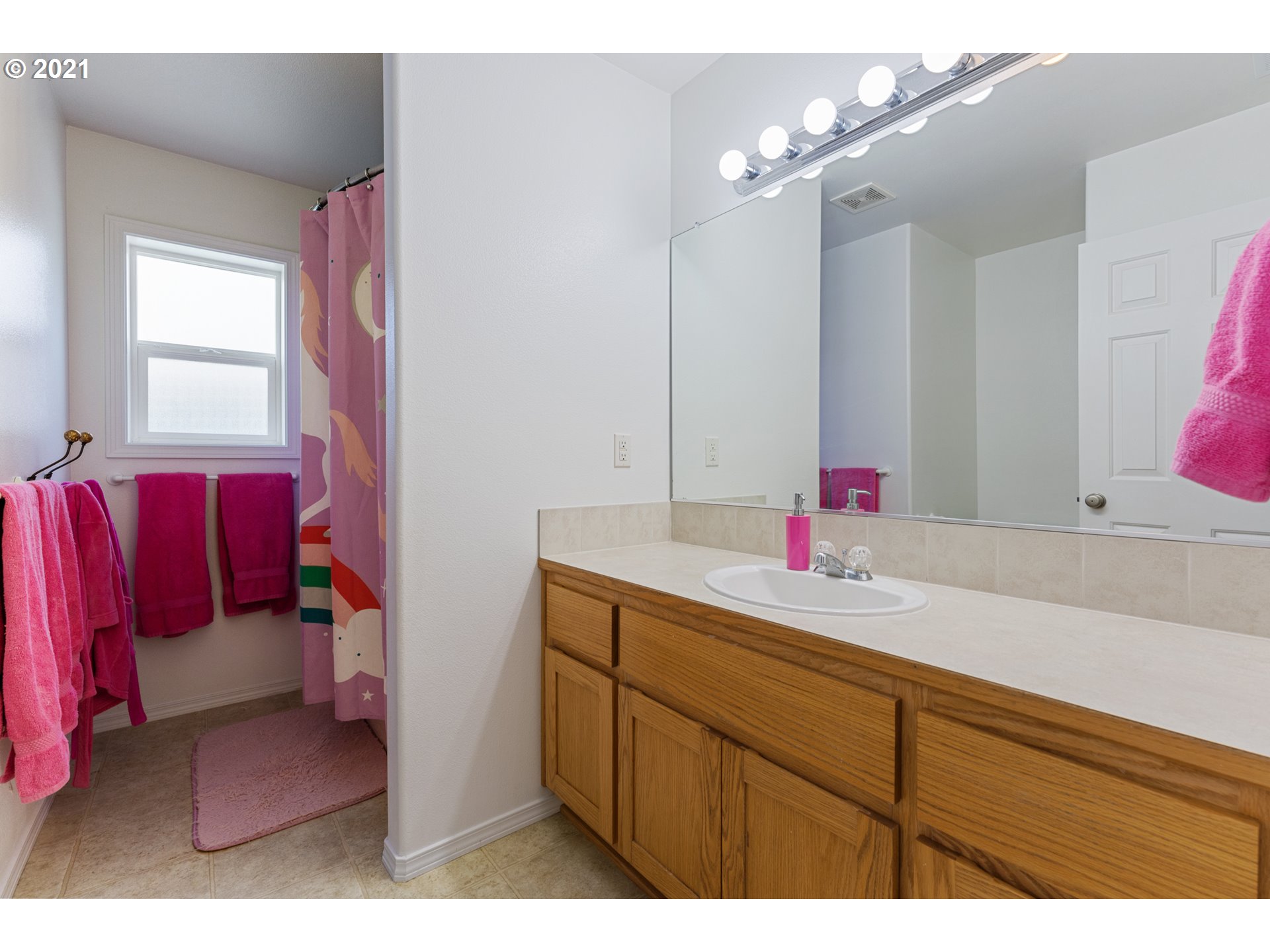 3122 South 2nd Street Ridgefield, WA 98642 - Photo 26 of 30 a bathroom with a sink vanity and a mirror