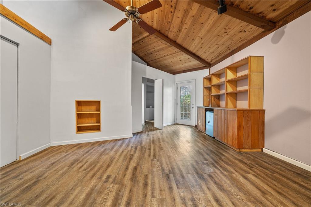 3775 27th Avenue Southwest Naples, FL 34117 - Photo 19 of 38 a view of an empty room with wooden floor and a window