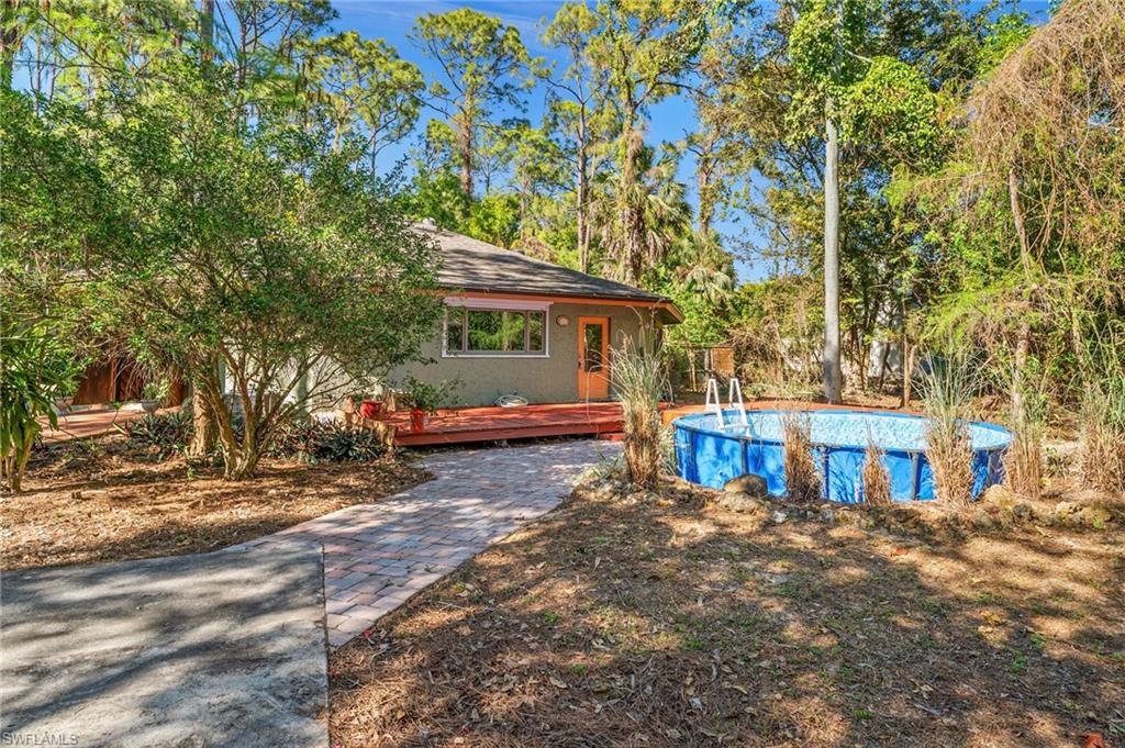 3775 27th Avenue Southwest Naples, FL 34117 - Photo 25 of 38 a view of house with outdoor space and sitting area