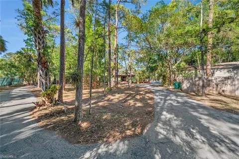 a view of outdoor space with deck and trees