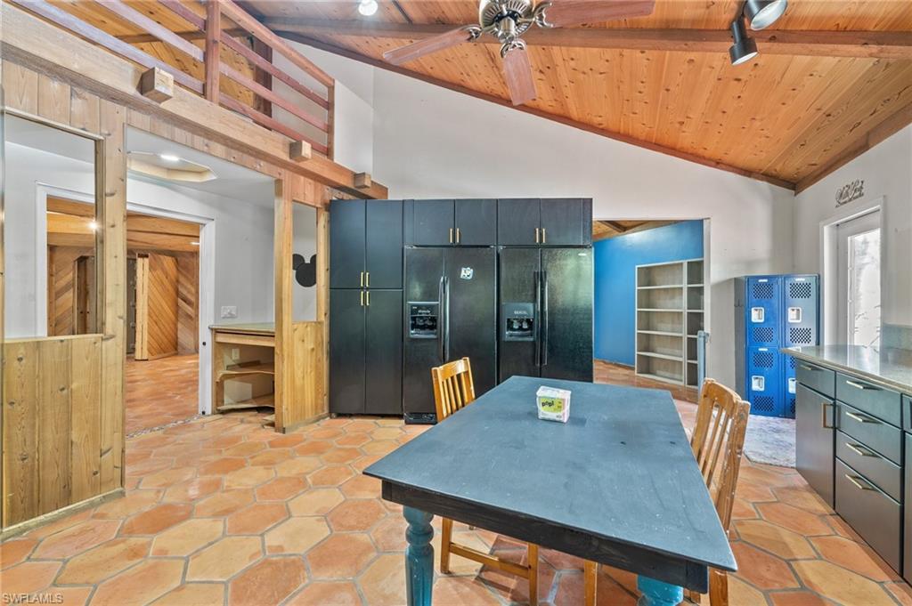 3775 27th Avenue Southwest Naples, FL 34117 - Photo 3 of 38 a dining room with a table and chairs
