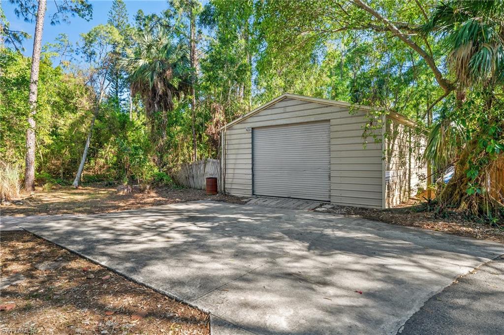 3775 27th Avenue Southwest Naples, FL 34117 - Photo 33 of 38 a house with a tree in front of it