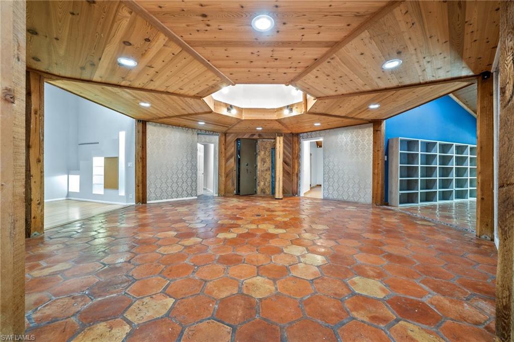 3775 27th Avenue Southwest Naples, FL 34117 - Photo 7 of 38 a view of an empty room with a chandelier