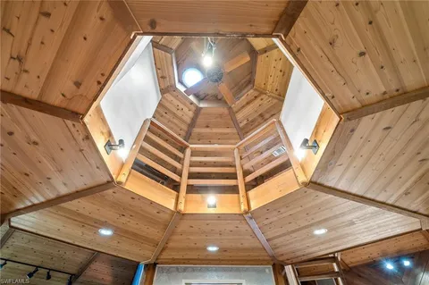 a view of staircase with a rug