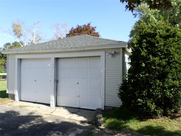 41 Ruggles Street Three Rivers, MA 01080 - Photo 4 of 30 a front view of a house with a yard and garage