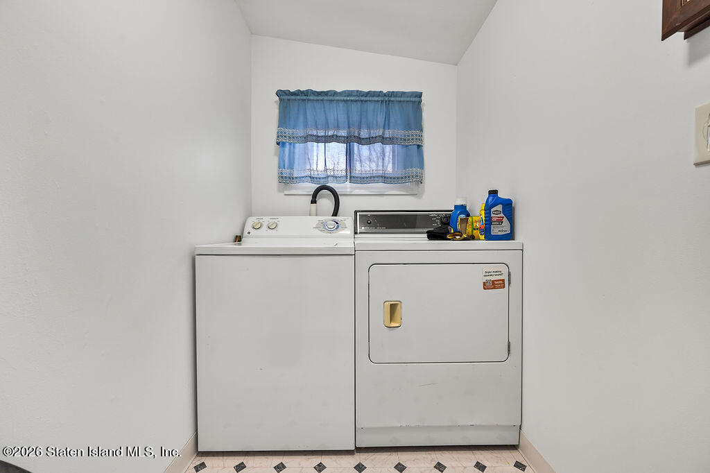 5272 Arthur Kill Road Staten Island, NY 10307 - Photo 12 of 32 a utility room with dryer and washer