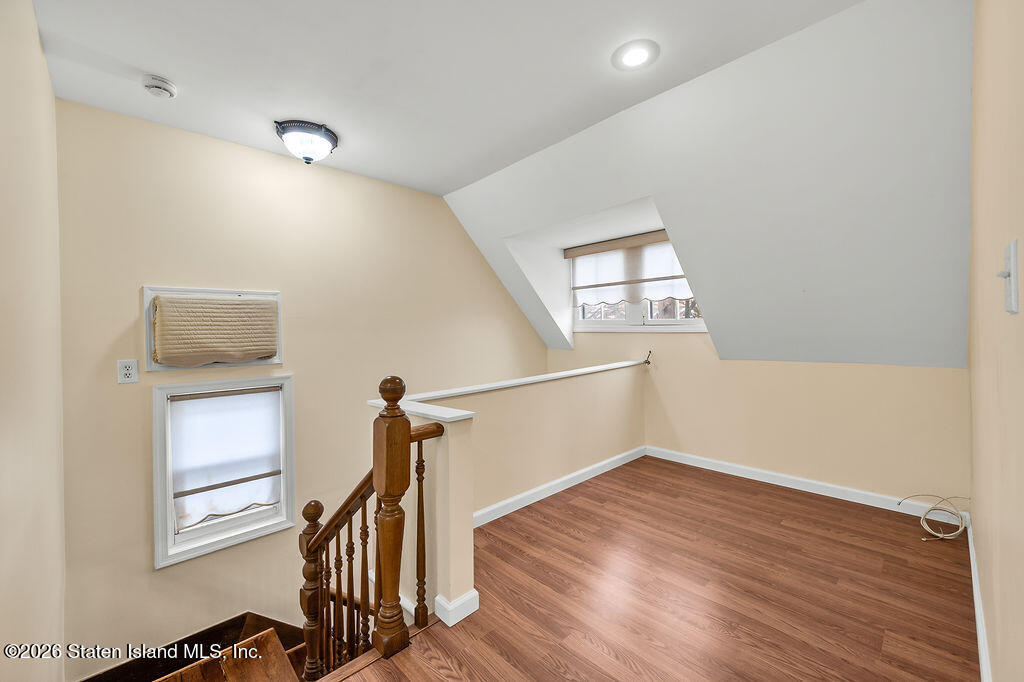 5272 Arthur Kill Road Staten Island, NY 10307 - Photo 16 of 32 a view of hallway with stairs and wooden floor