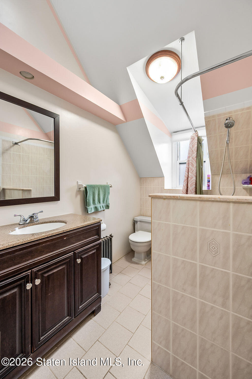 5272 Arthur Kill Road Staten Island, NY 10307 - Photo 21 of 32 a bathroom with a sink a toilet and mirror