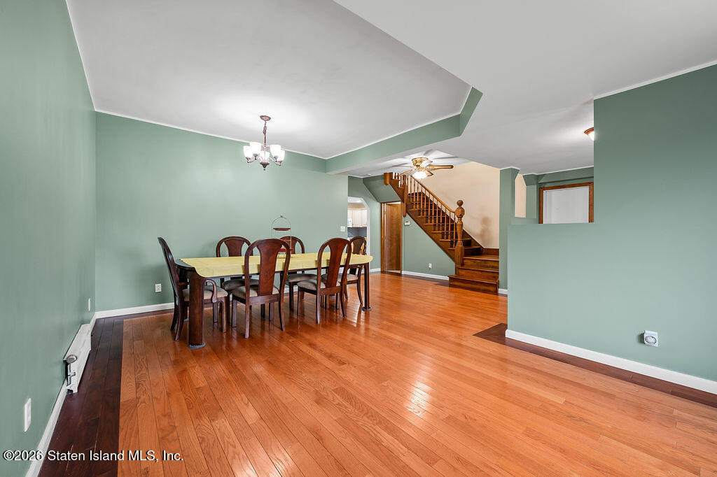 5272 Arthur Kill Road Staten Island, NY 10307 - Photo 22 of 32 a view of a dining room with furniture and wooden floor