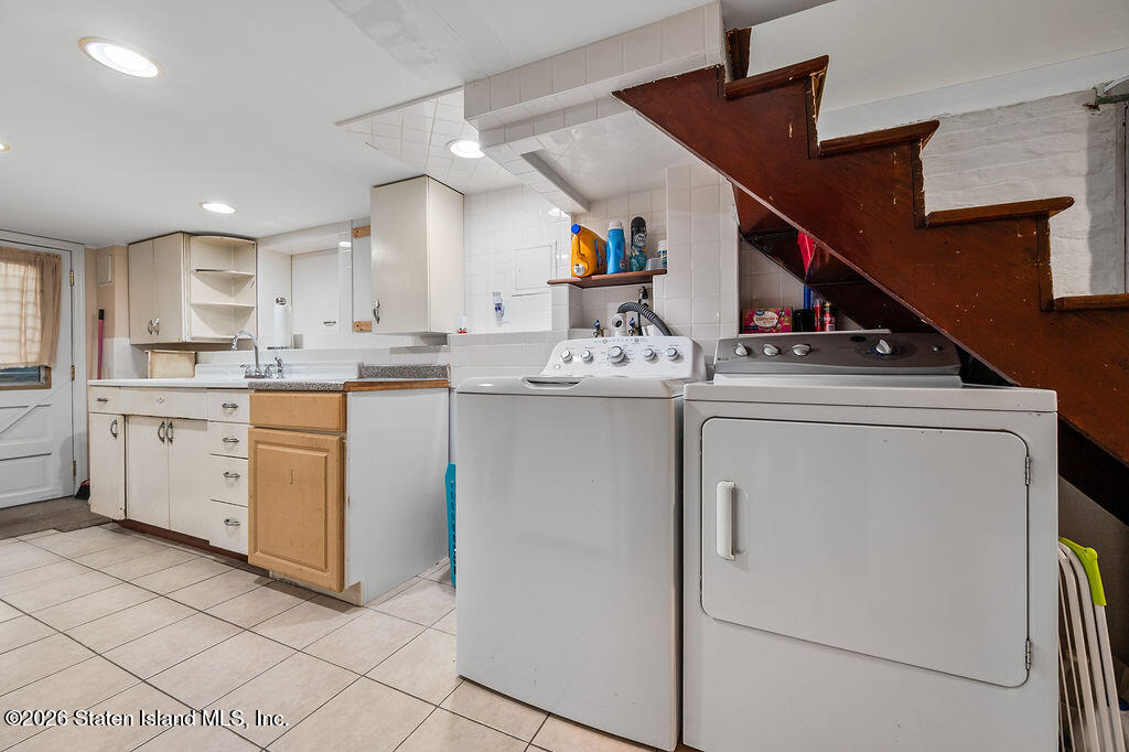 5272 Arthur Kill Road Staten Island, NY 10307 - Photo 24 of 32 a kitchen with a sink and cabinets