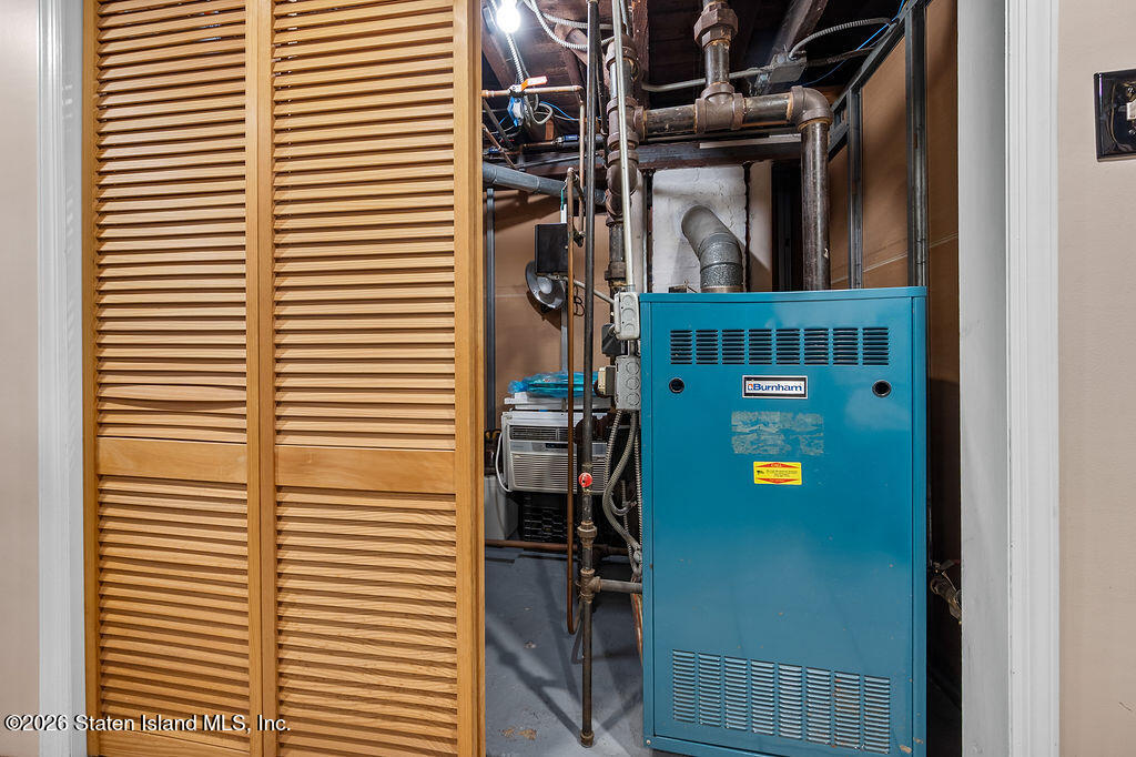 5272 Arthur Kill Road Staten Island, NY 10307 - Photo 29 of 32 a view of a room with washer and dryer