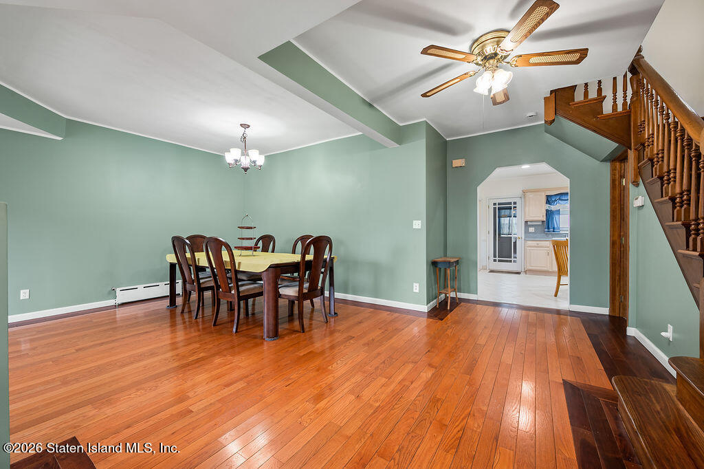 5272 Arthur Kill Road Staten Island, NY 10307 - Photo 5 of 32 a view of a livingroom with furniture and chandelier fan