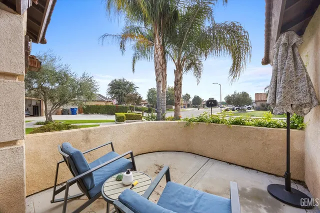 a view of swimming pool with outdoor seating and plants