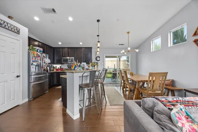 a view of a dining room with furniture window and outside view