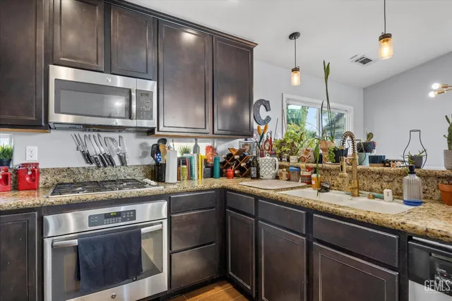 a view of a kitchen and sink