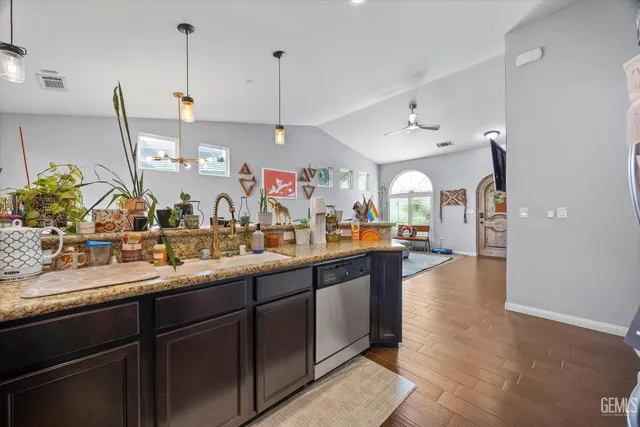a living room with furniture and a book shelf