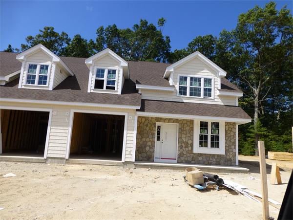 53 Baldwin Road, Unit 1703 Billerica, MA 01821 - Photo 3 of 15 a front view of a house with a yard