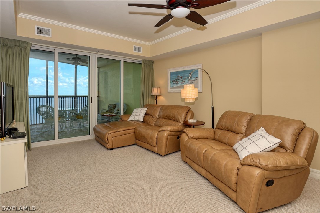 2797 First Street, Unit 1802 Fort Myers, FL 33916 - Photo 11 of 32 a living room with furniture and a large window