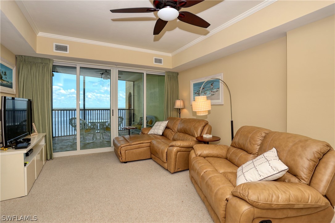 2797 First Street, Unit 1802 Fort Myers, FL 33916 - Photo 12 of 32 a living room with furniture and a flat screen tv