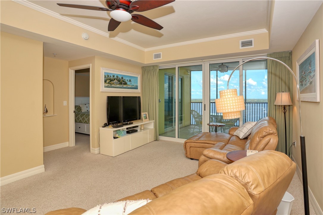 2797 First Street, Unit 1802 Fort Myers, FL 33916 - Photo 13 of 32 a living room with furniture tv and a large window