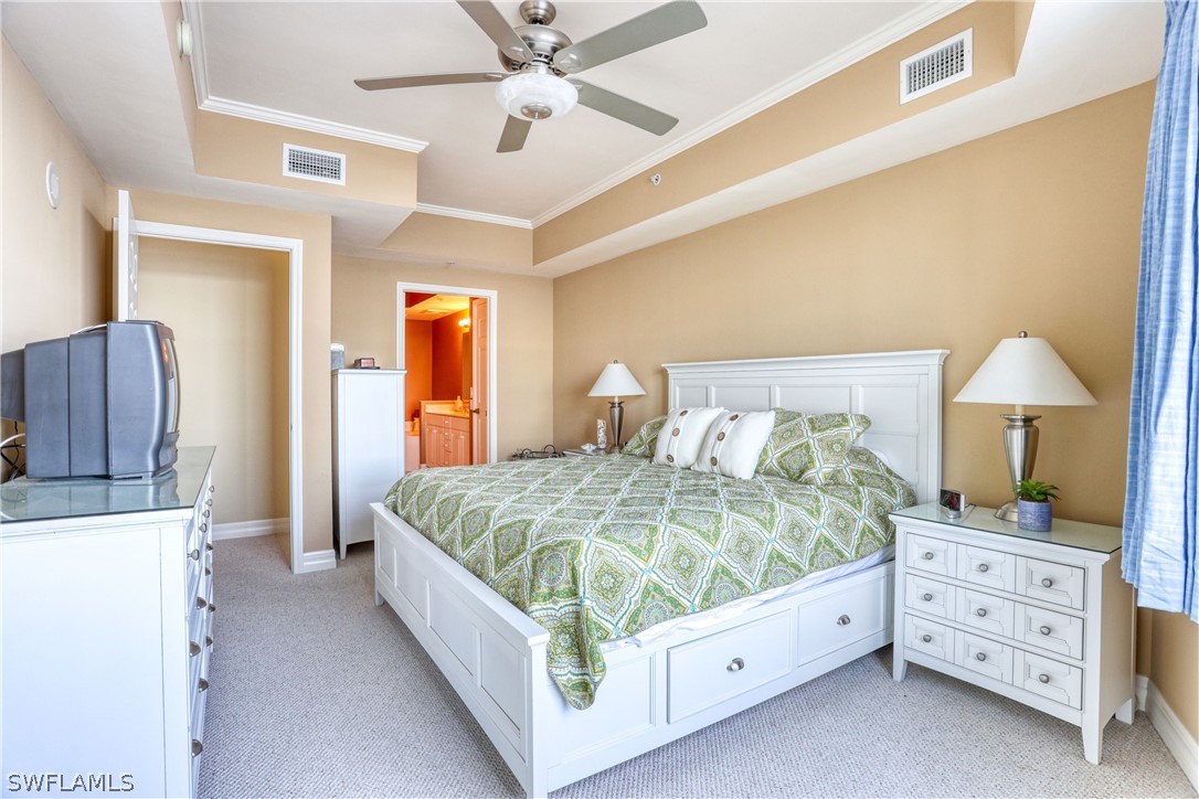 2797 First Street, Unit 1802 Fort Myers, FL 33916 - Photo 16 of 32 a bed room with a bed and a lamp