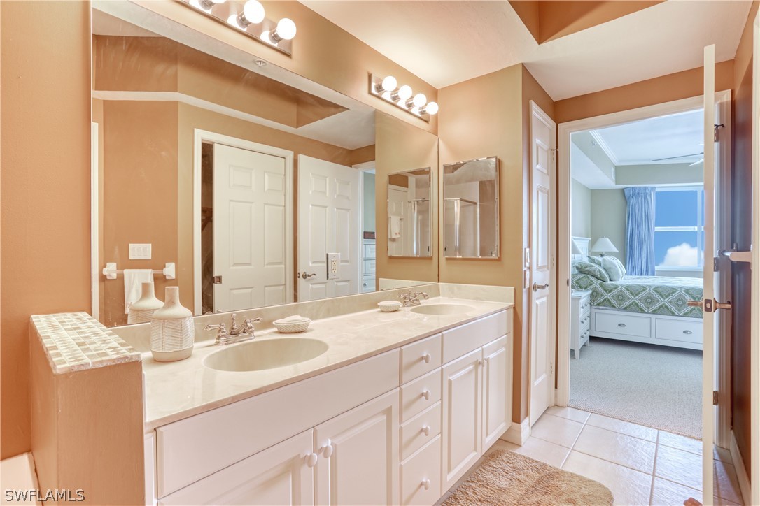 2797 First Street, Unit 1802 Fort Myers, FL 33916 - Photo 18 of 32 a spacious bathroom with a sink double vanity and a mirror