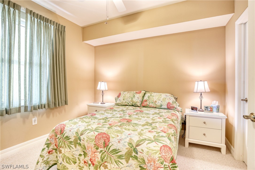 2797 First Street, Unit 1802 Fort Myers, FL 33916 - Photo 21 of 32 a bedroom with a bed and a window