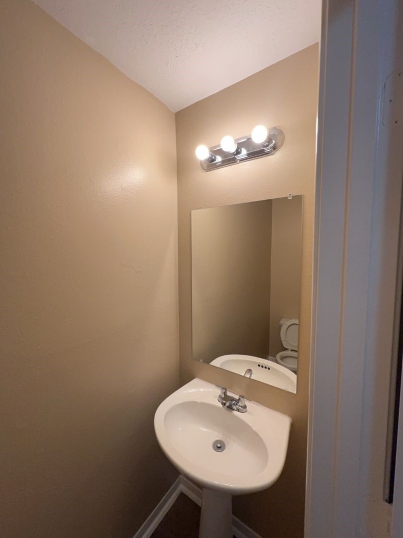 16410 Amy Ridge Road Houston, TX 77053 - Photo 12 of 17 a bathroom with a sink and mirror