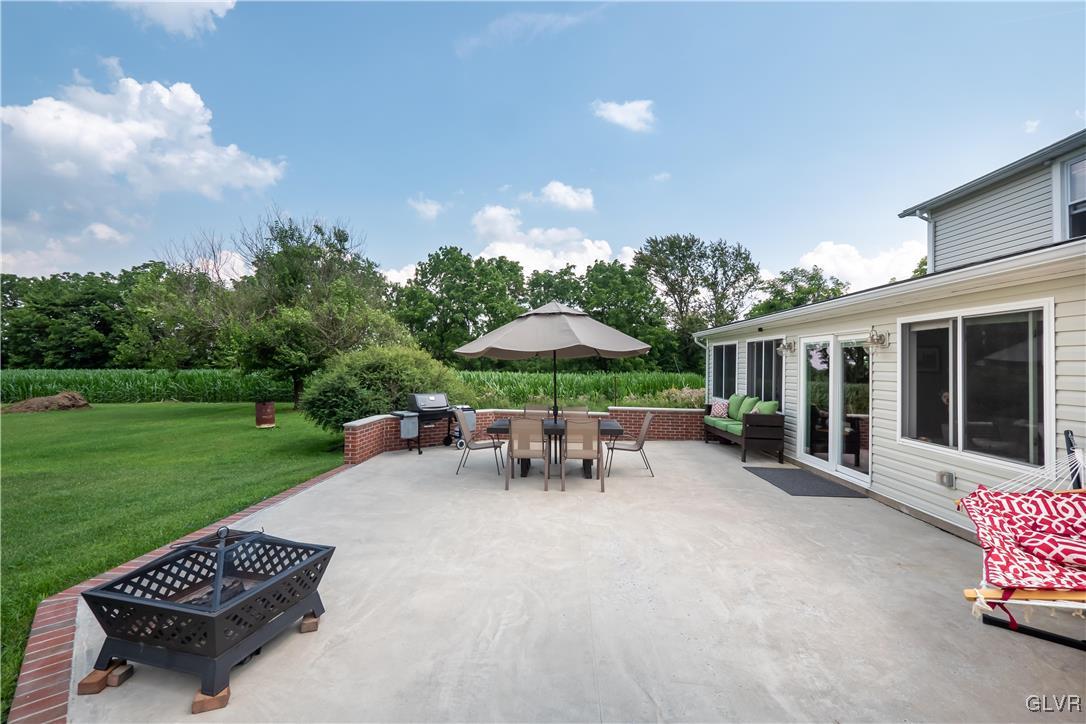696 Cherry Hill Road Nazareth, PA 18064 - Photo 39 of 46 a view of a patio with a table and chairs