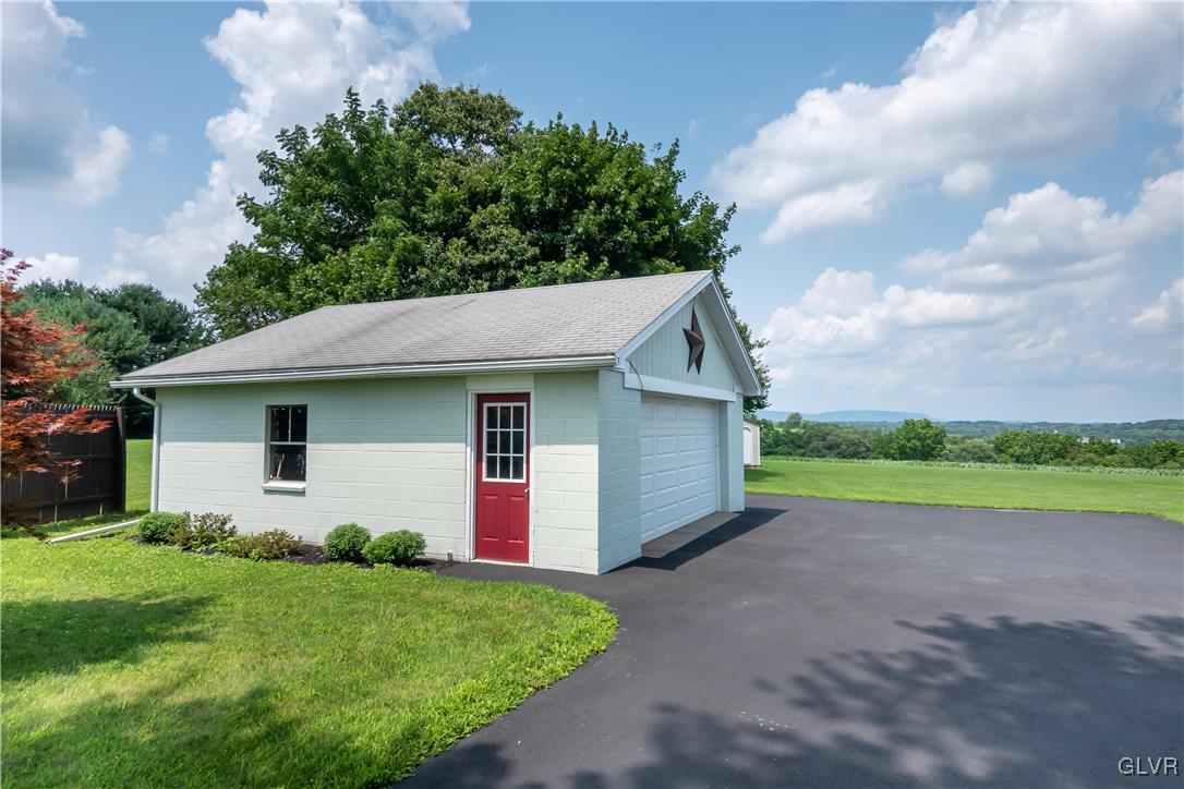 696 Cherry Hill Road Nazareth, PA 18064 - Photo 41 of 46 a house with green field in front of it