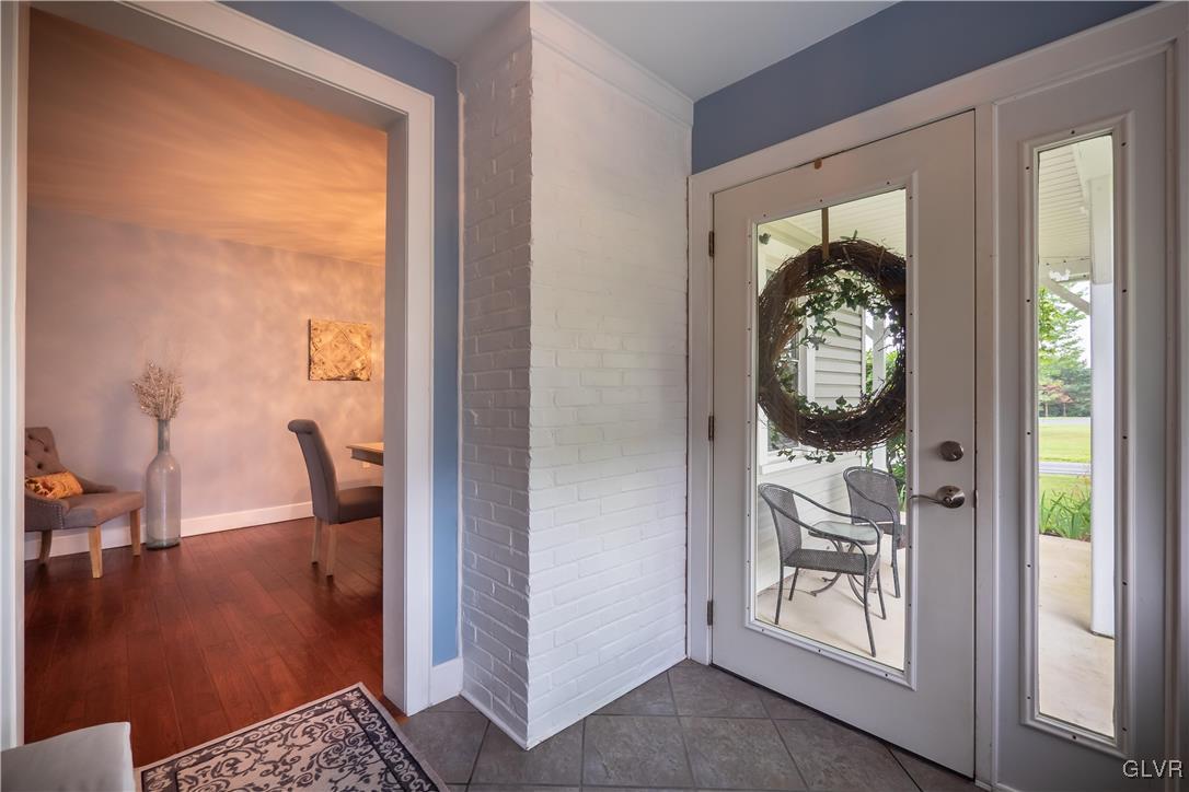 696 Cherry Hill Road Nazareth, PA 18064 - Photo 5 of 46 a view of a hallway and a livingroom with furniture