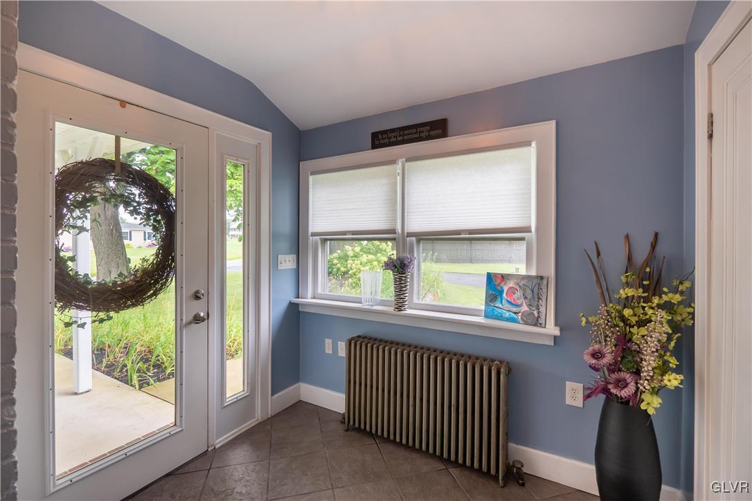 696 Cherry Hill Road Nazareth, PA 18064 - Photo 6 of 46 a view of a room that has a large window and front door