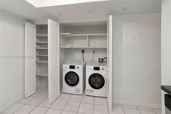 a view of a refrigerator and washer