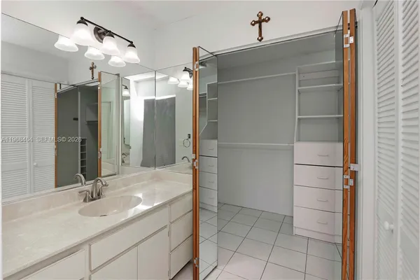 a bathroom with a shower and a sink