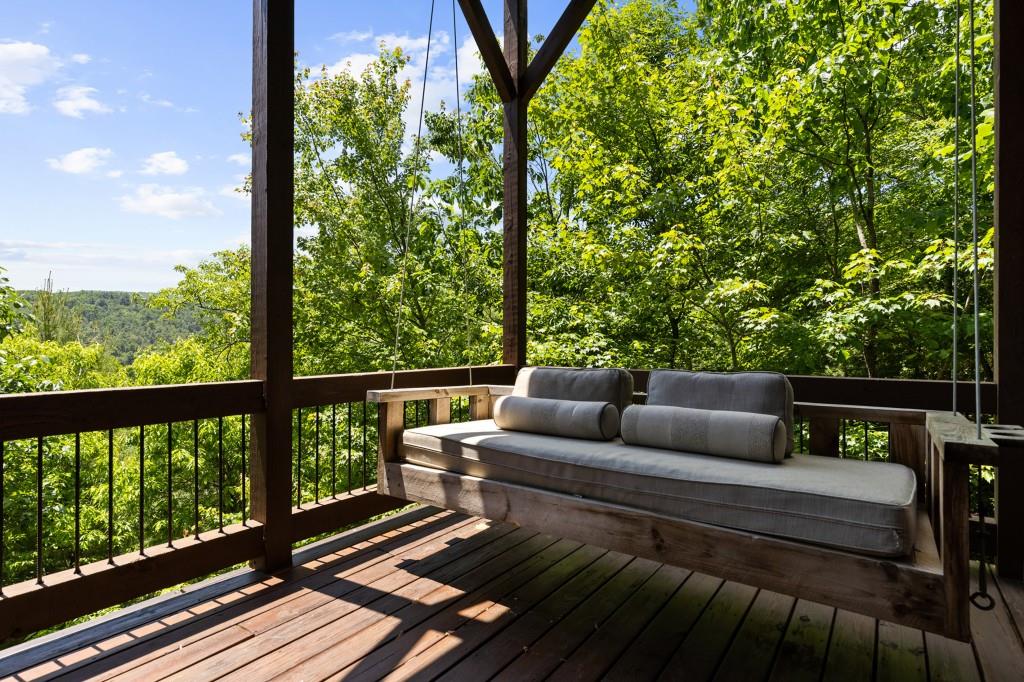 436 Geronimo Road Cherry Log, GA 30522 - Photo 35 of 58 a balcony with wooden floor and outdoor seating