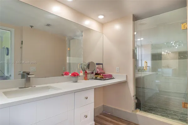 a bathroom with a sink and a mirror