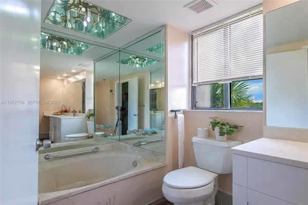 a bathroom with a toilet a sink and a bathtub